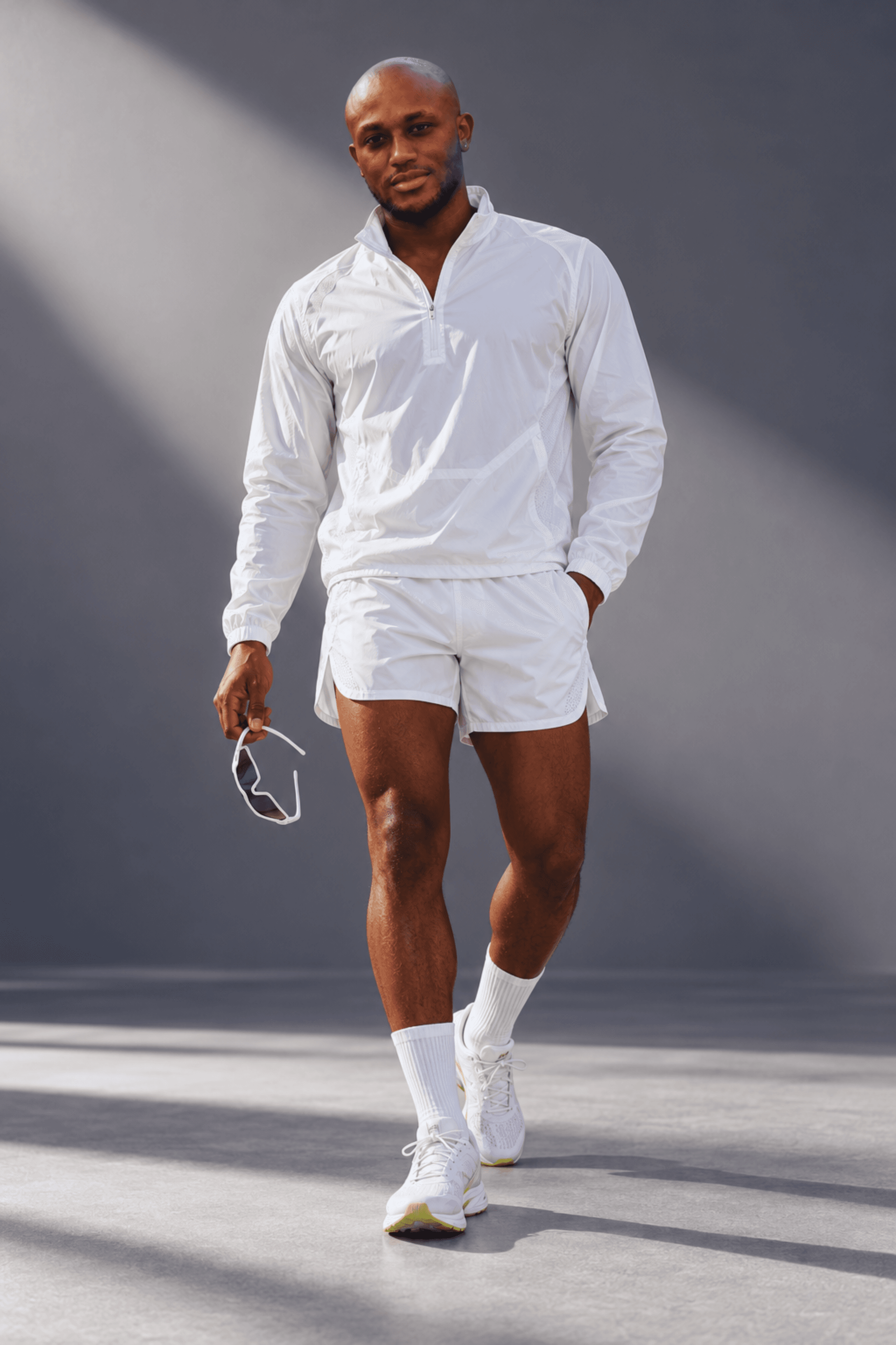 Muiz in athletic wear on a tennis court, image 2