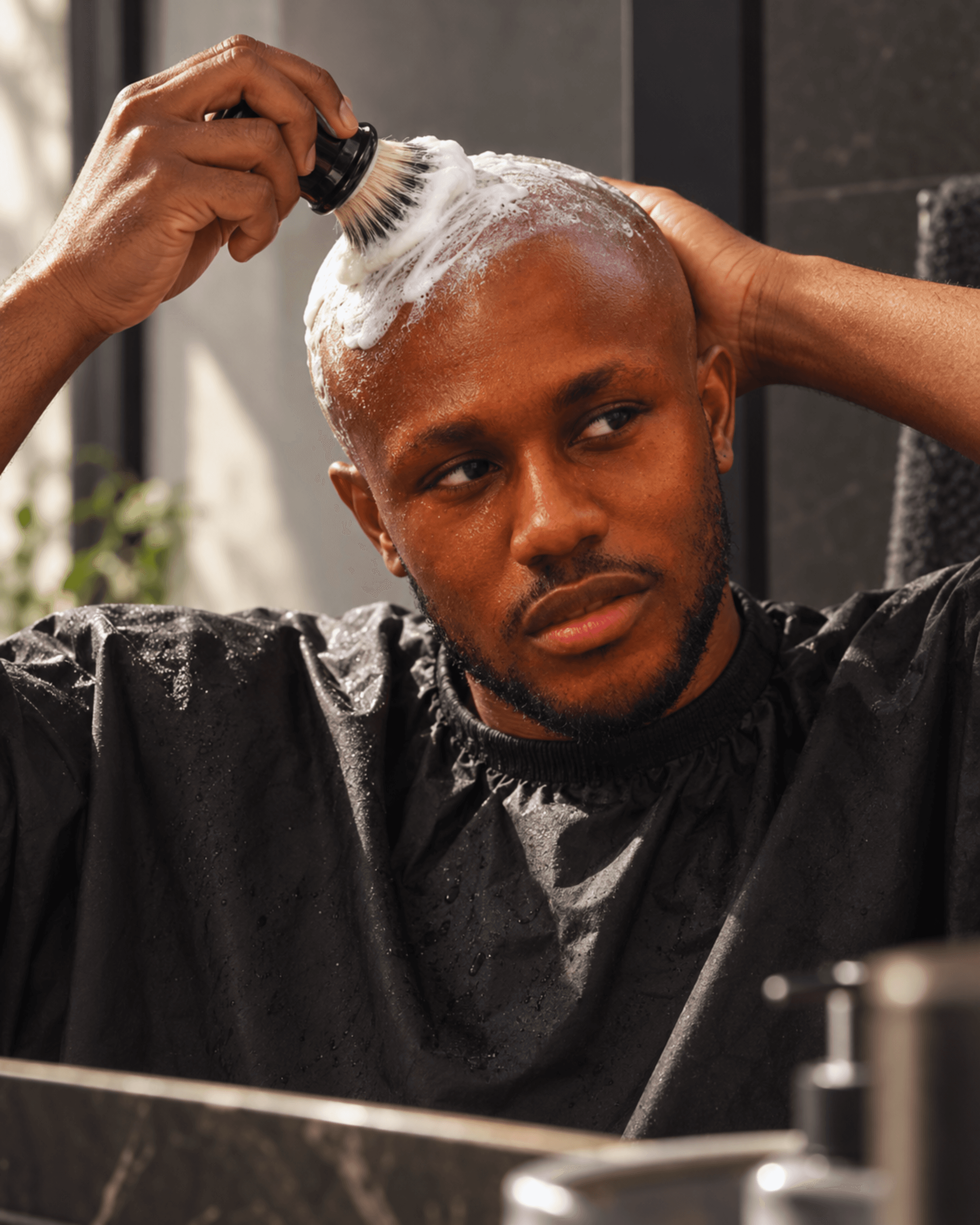 Male model doing his skin care routine on the morning of a shoot